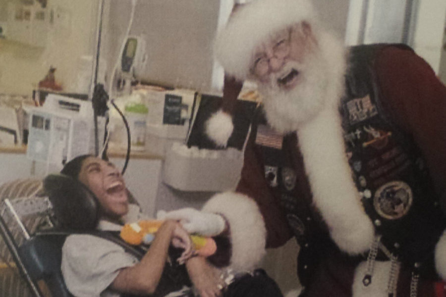 Joe+Sarnoski+brings+a+smile+to+the+faces+of+the+children+he+visits+in+local+hospitals.+He%27s+affectionately+called+%22Santa%22+by+all.
