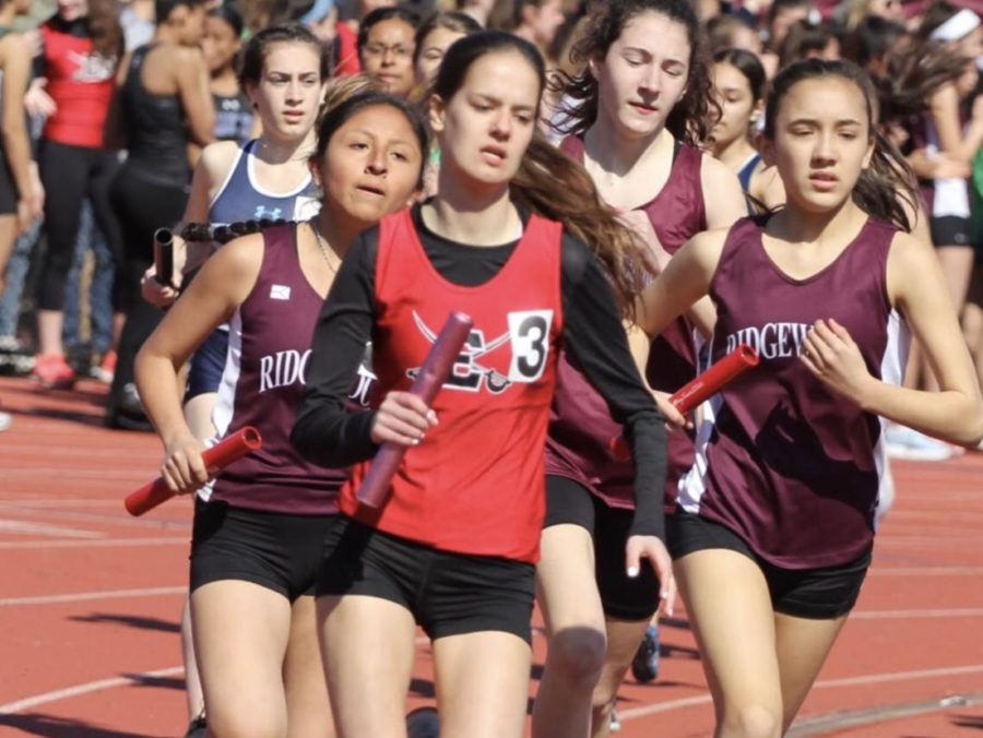 Eliza+Dul+is+in+the+lead+for+the+4+by+800+meter+relay.