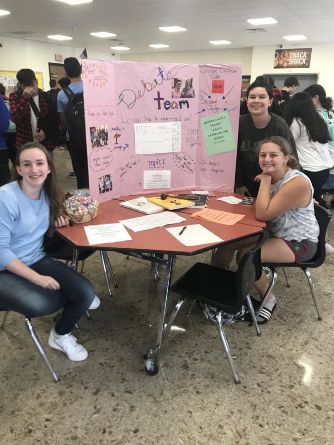 Debate Team member Olivia Piserchia, William Bollbach, and Samantha Robinson promoting the Debate Team!