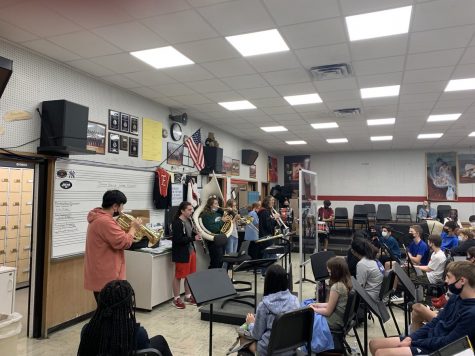 Members of the Emerson Marching Band giving a demonstration to Junior High band members