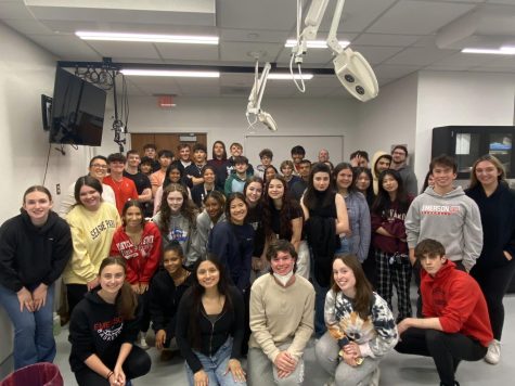 Group photo taken by Professor Adam Divine after the cadaver viewing experience.