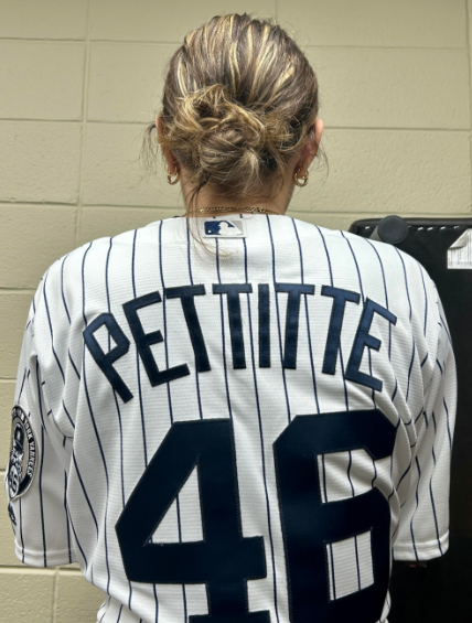 Emerson Junior, Isabella Lupano, participating in spirt week by wearing her sports jersey for Jersey Day.