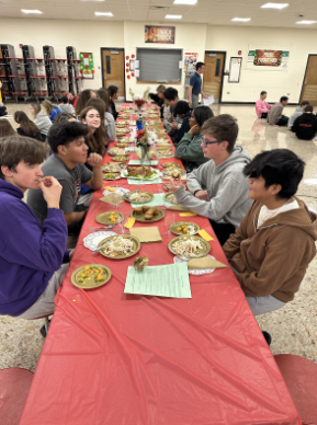 Emerson Key Club Members eating food in the cafeteria November 18, 2023. 

