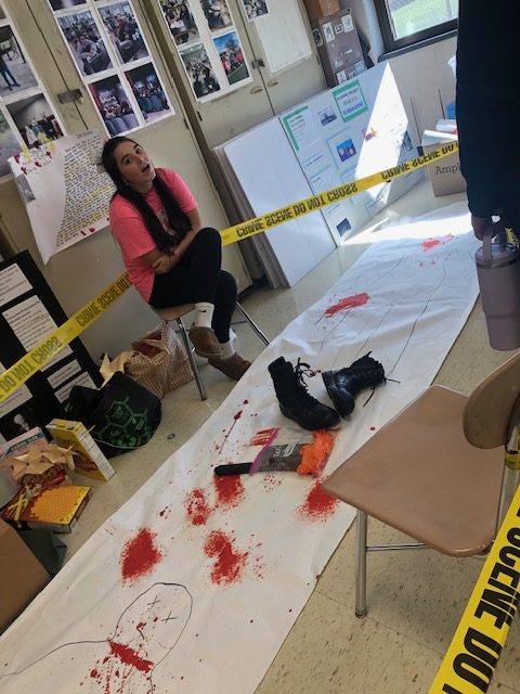 Lily Downing beholds at grisly scene in room 121 at EHS.