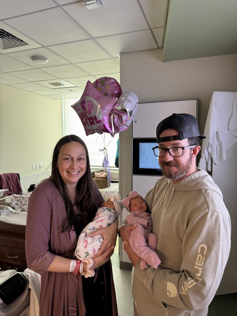 Happy teachers and parents, Mrs. Osso and Mr. Compagnone proudly display their new bundles of joy.
