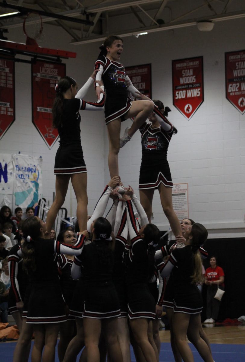 Pyramid stunt during cheer routine. 
