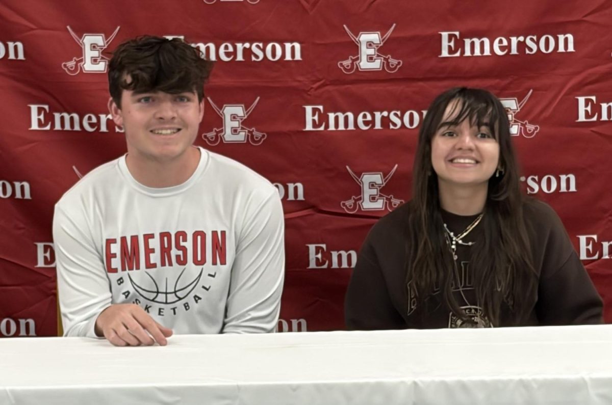 Pleasantly surprised, Jacob Murphy and Briella Donahue smile for the cameras as they adjust to their new titles of Salutatorian and Valedictorian - respectively.