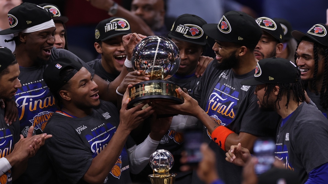 The New York Knicks hold the Eastern Conference Championship trophy after Game 4. 